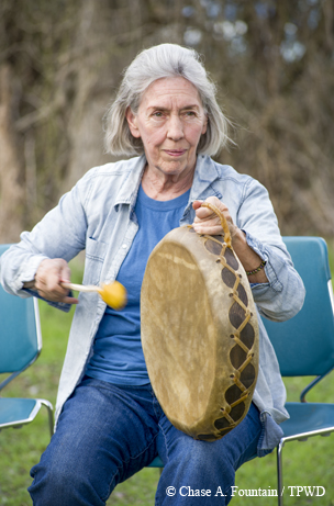 A drummer keeps the beat during a musical performance at McKinney Falls State Park.