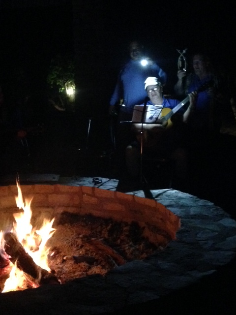 Singing around a campfire.