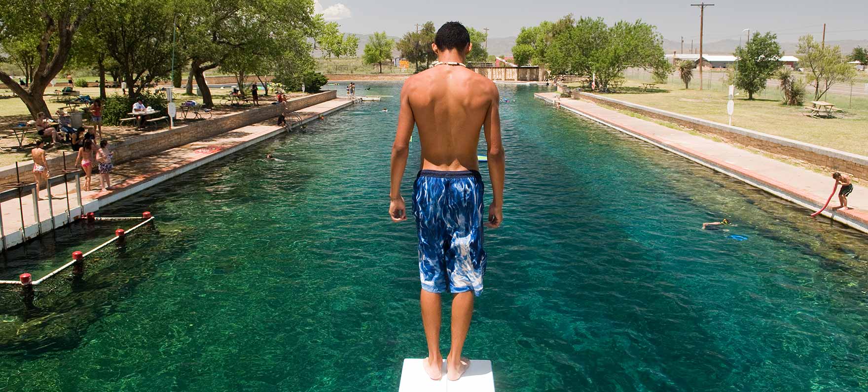 Preparing for a dive into the crystal clear, spring fed, Balmorhea State Park swimming pool.